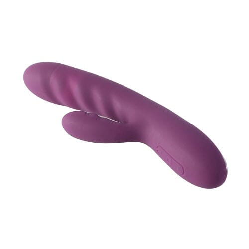 a purple vibrating device on a white background