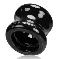 Black Oxballs Squeeze Ballstretcher for male enhancement, designed for comfortable ball stretching and support.
