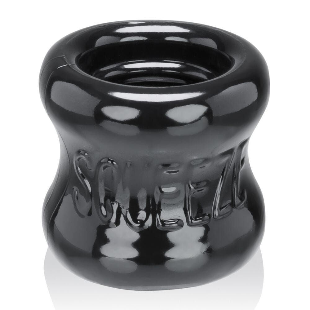 Black Oxballs Squeeze Ballstretcher for male enhancement, featuring a flexible, durable design with adjustable fit.