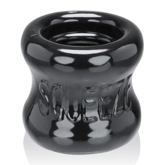 Black Oxballs Squeeze Ballstretcher for male enhancement, featuring a flexible, durable design with adjustable fit.