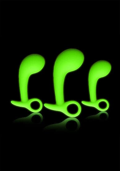 a pair of neon green hair clips sitting on top of a black surface