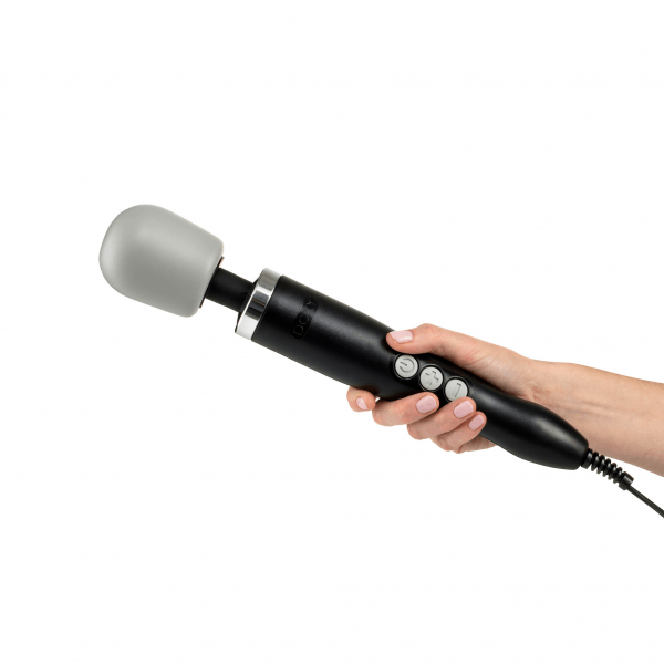 a person holding a microphone in their hand
